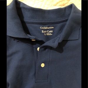 NWOT men’s large blue Easy Care polo shirt.